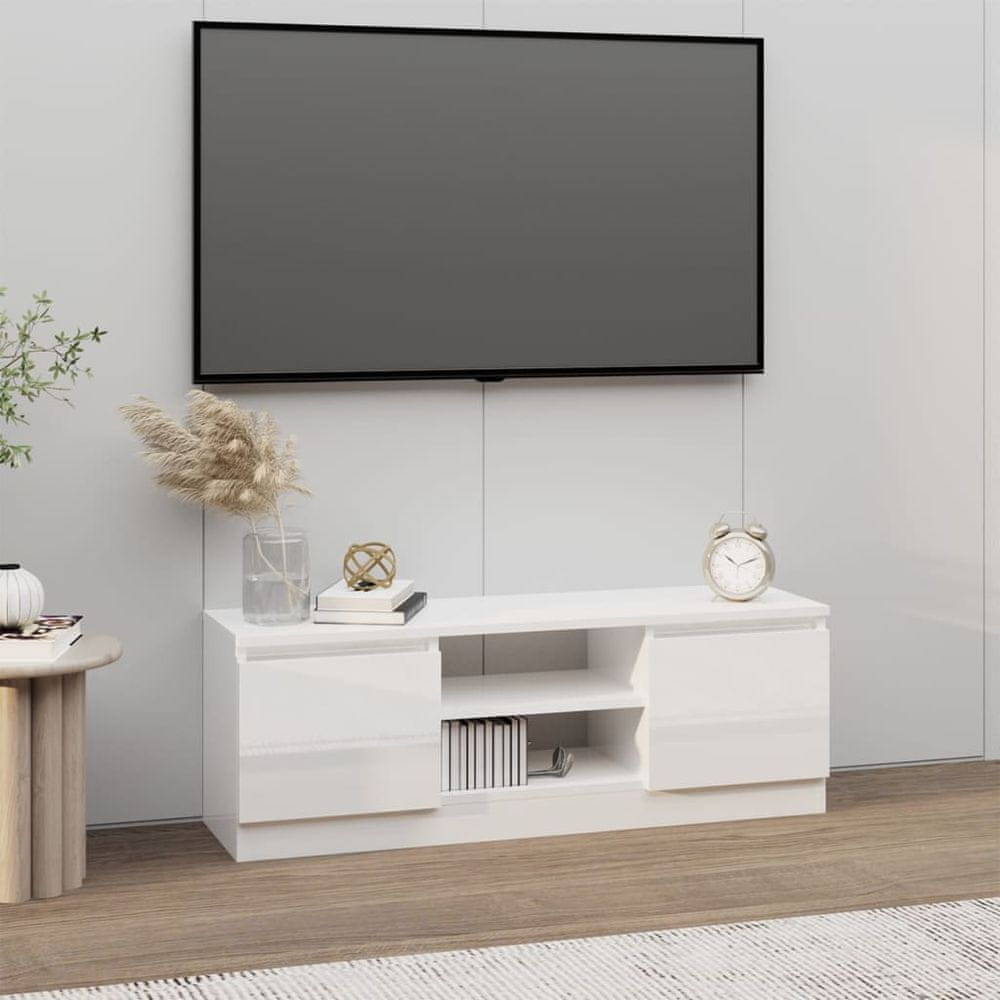 Vidaxl TV skrinka s dvierkami lesklá biela 102x30x36 cm